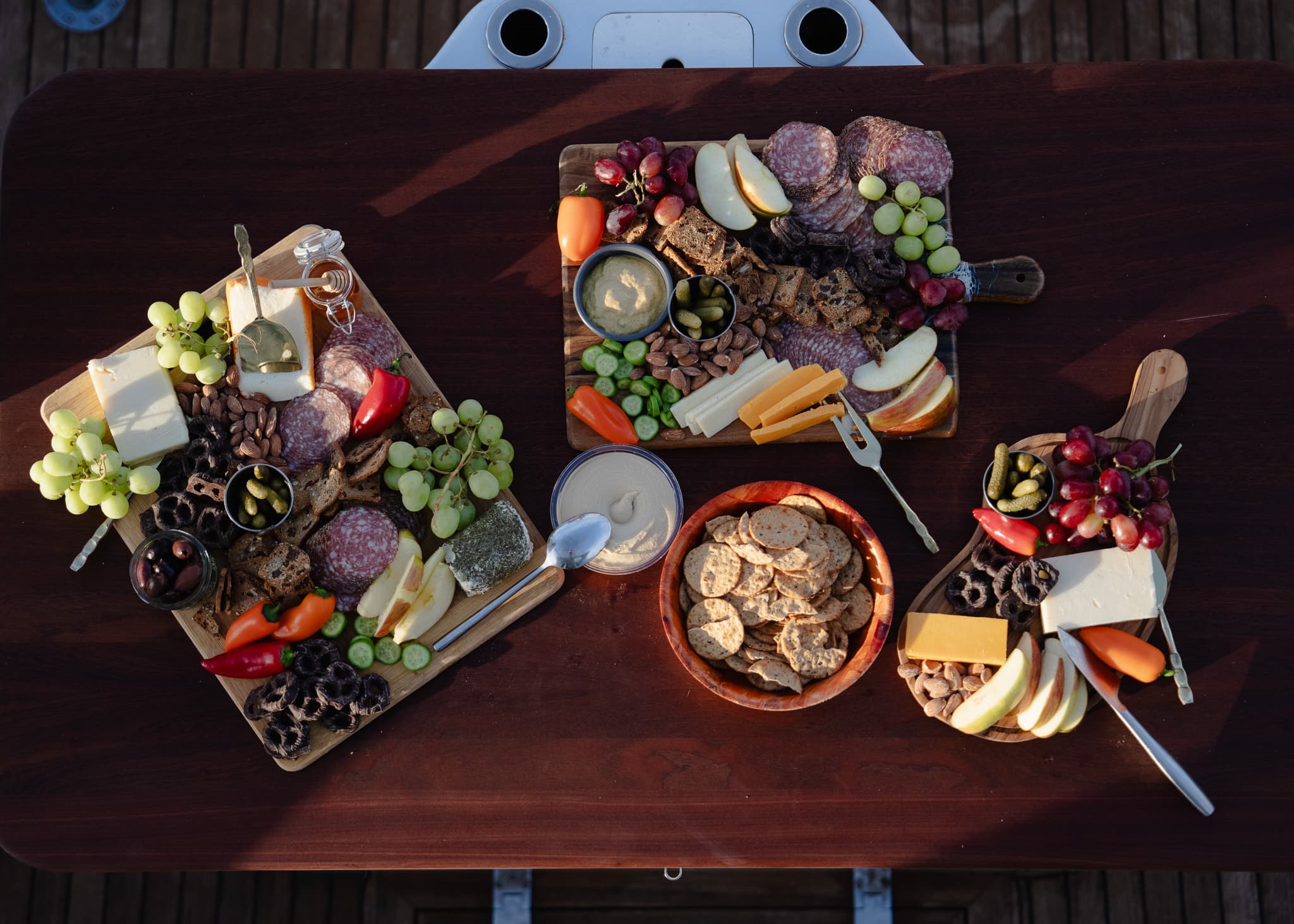Overhead view of the full charcuterie table laid out on deck