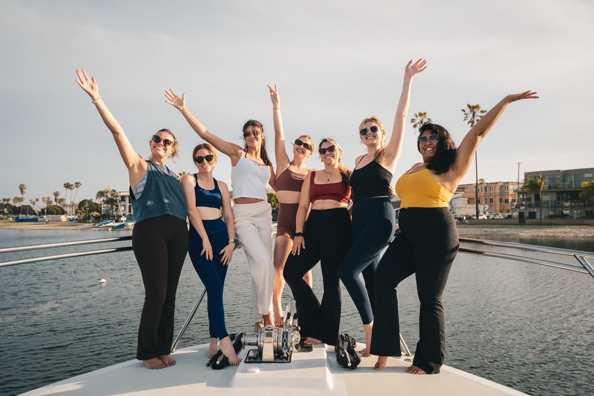 Guests celebrating on the bow with arms raised